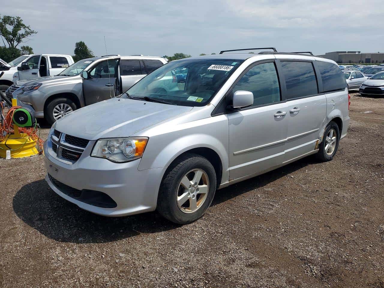 2012 Dodge Caravan — lot COPART #66088186, Avariat Lateral