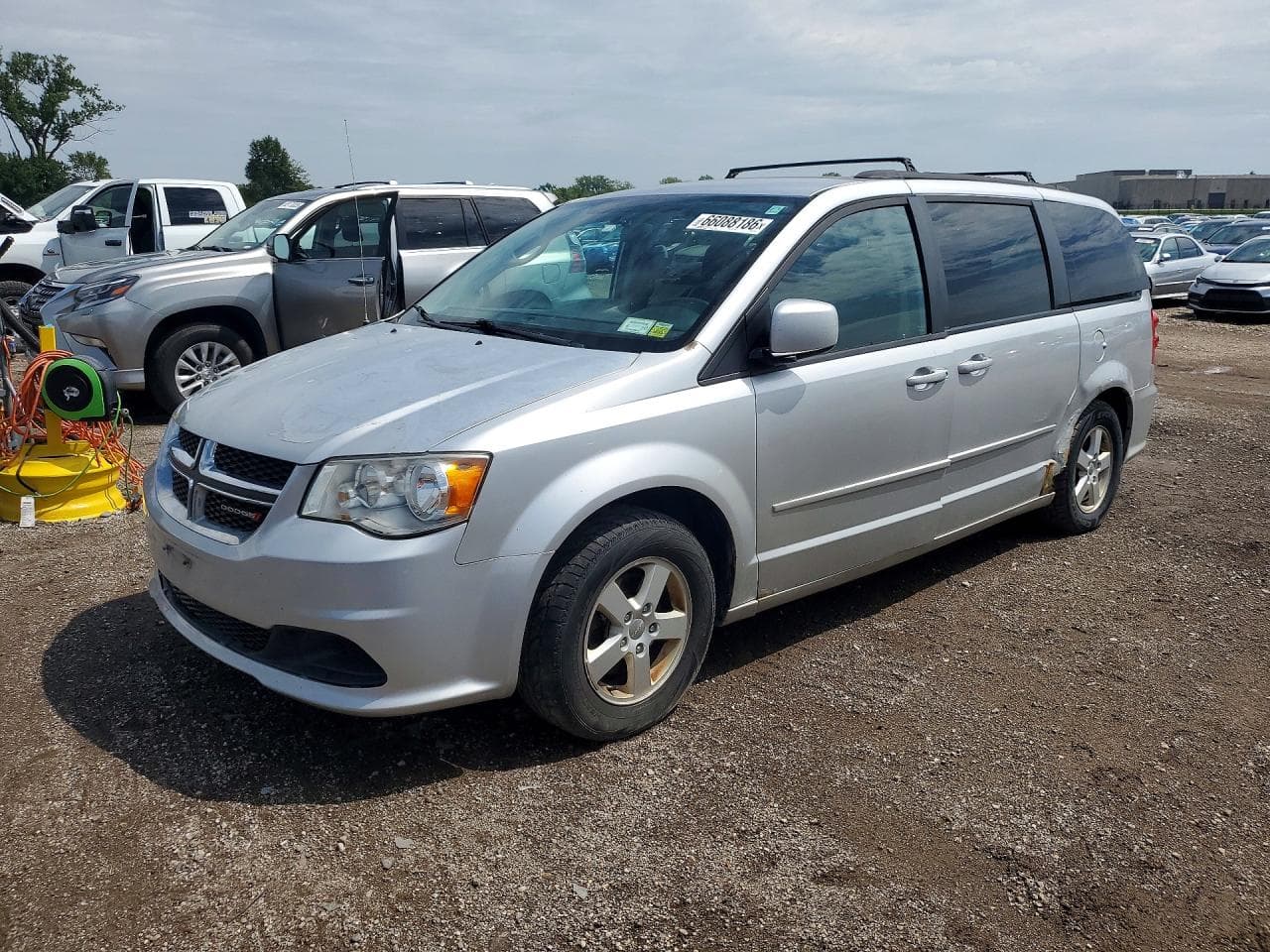 2012 Dodge Caravan — lot COPART #66088186, Avariat Lateral